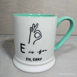 E is for‎ Eh, okay. Indigo mug E names okay symbol. Bright teal
